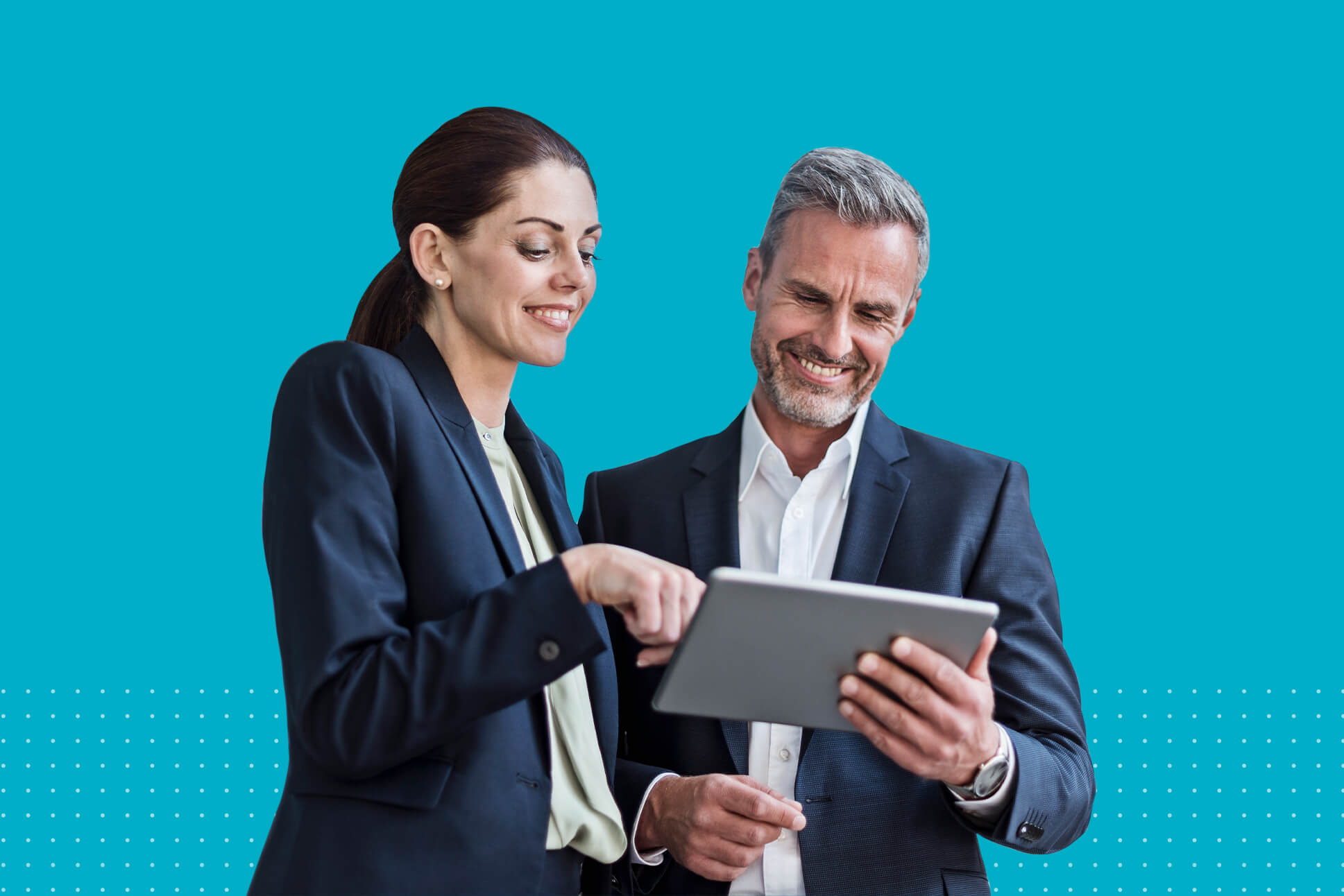 a man and a woman looking at a tablet